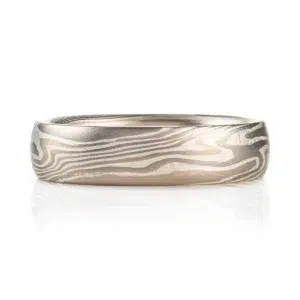 mokume gane low dome band in twisted pattern using white gold, silver and palladium