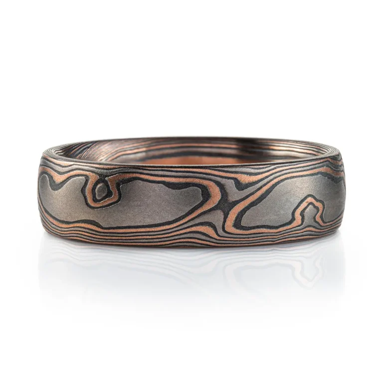 woodgrain patterned mokume gane ring with red gold, palladium and oxidized silver