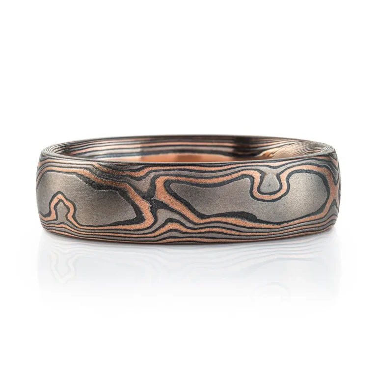 woodgrain patterned mokume gane ring with red gold, palladium and oxidized silver