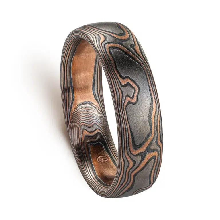 woodgrain patterned mokume gane ring with red gold, palladium and oxidized silver