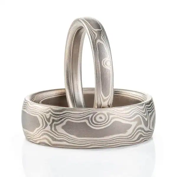 set of mokume gane bands in silvery palette