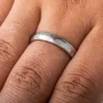 light silvery colored mokume gane ring made in woodgrain pattern with surface carving for added texture