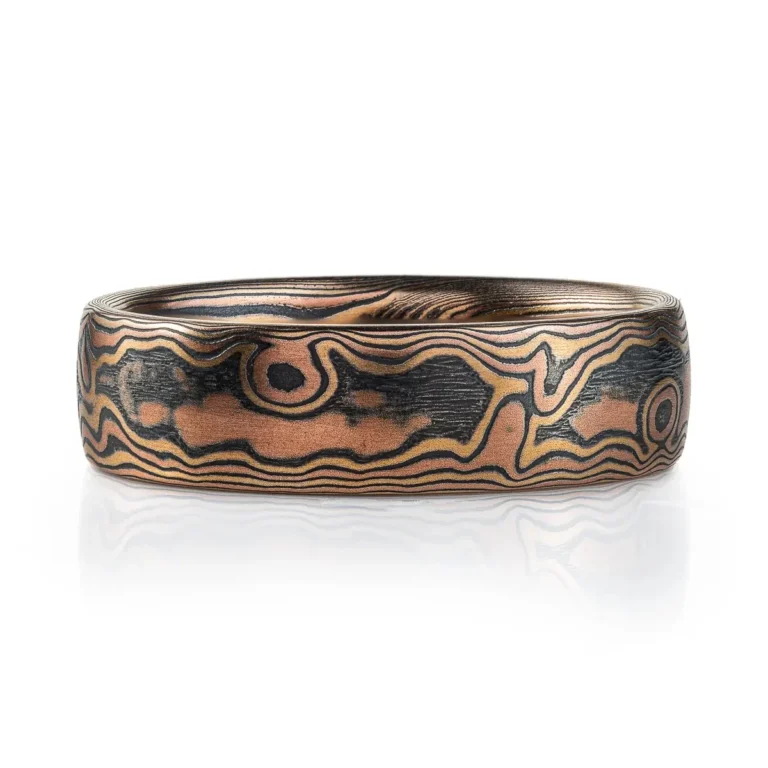 mokume gane woodgrain style patterned ring, made with red gold, yellow gold and oxidized silver