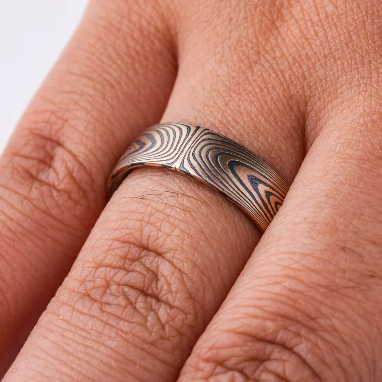 Graphic feeling mokume gane patterned band, made in Arn Krebs Vortex pattern, linear design that is mirrored at the center.