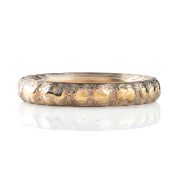 Slim elegant mokume gane ring in Arn Krebs signature Guri Bori pattern, resembling the texture of rock and mountain ranges.