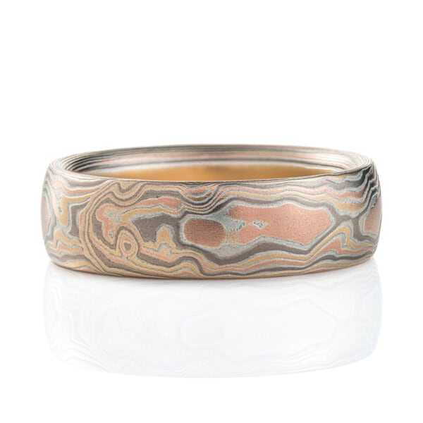 Light feeling men's mokume gane ring made to look like wood grain, made with red gold, yellow gold, palladium and etched silver.