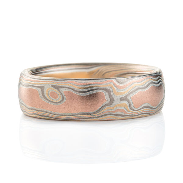 Light feeling men's mokume gane ring made to look like wood grain, made with red gold, yellow gold, palladium and etched silver.