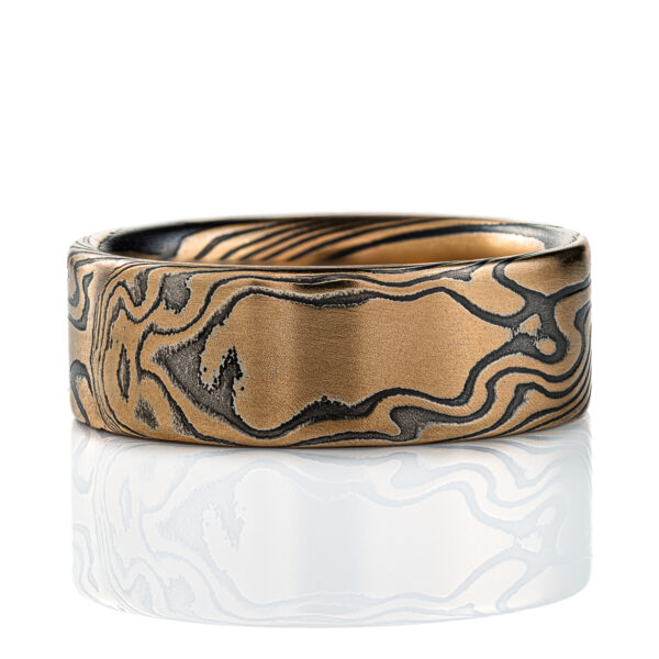 High contrast yellow gold and black ring, made in mokume twist pattern, alternating stripes of black and yellow.