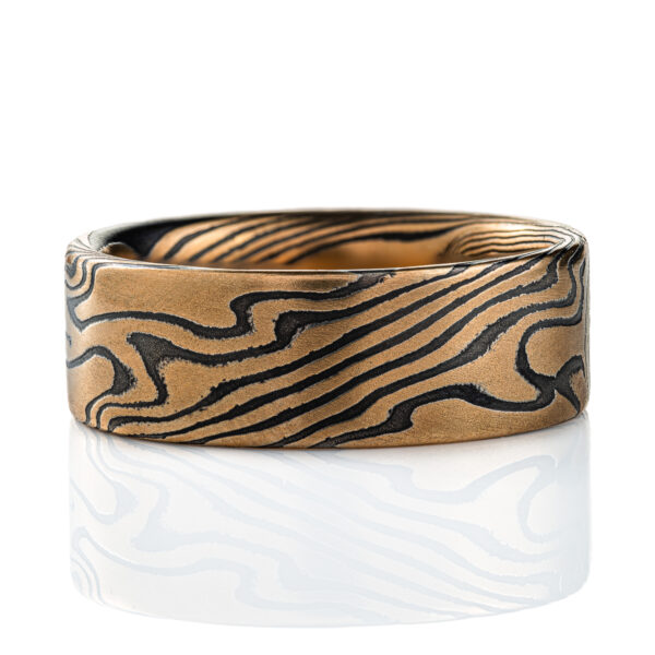 High contrast yellow gold and black ring, made in mokume twist pattern, alternating stripes of black and yellow.