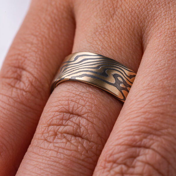 High contrast yellow gold and black ring, made in mokume twist pattern, alternating stripes of black and yellow.