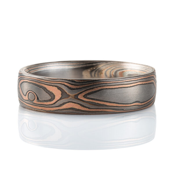 Woodgrain patterned mokume gane band, made with red gold, palladium, and oxidized silver (black).