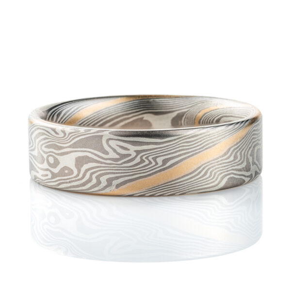 Wide flat profile mokume gane ring, patterned in twisting style, made with layers of palladium and silver for an overall gray palette, with one stripe of yellow gold.