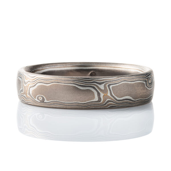 Mokume gane gray toned band, made to resemble woodgrain. Smooth surface, made with white gold, palladium and silver.