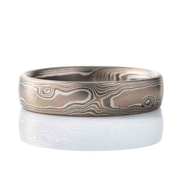Mokume gane gray toned band, made to resemble woodgrain. Smooth surface, made with white gold, palladium and silver. .
