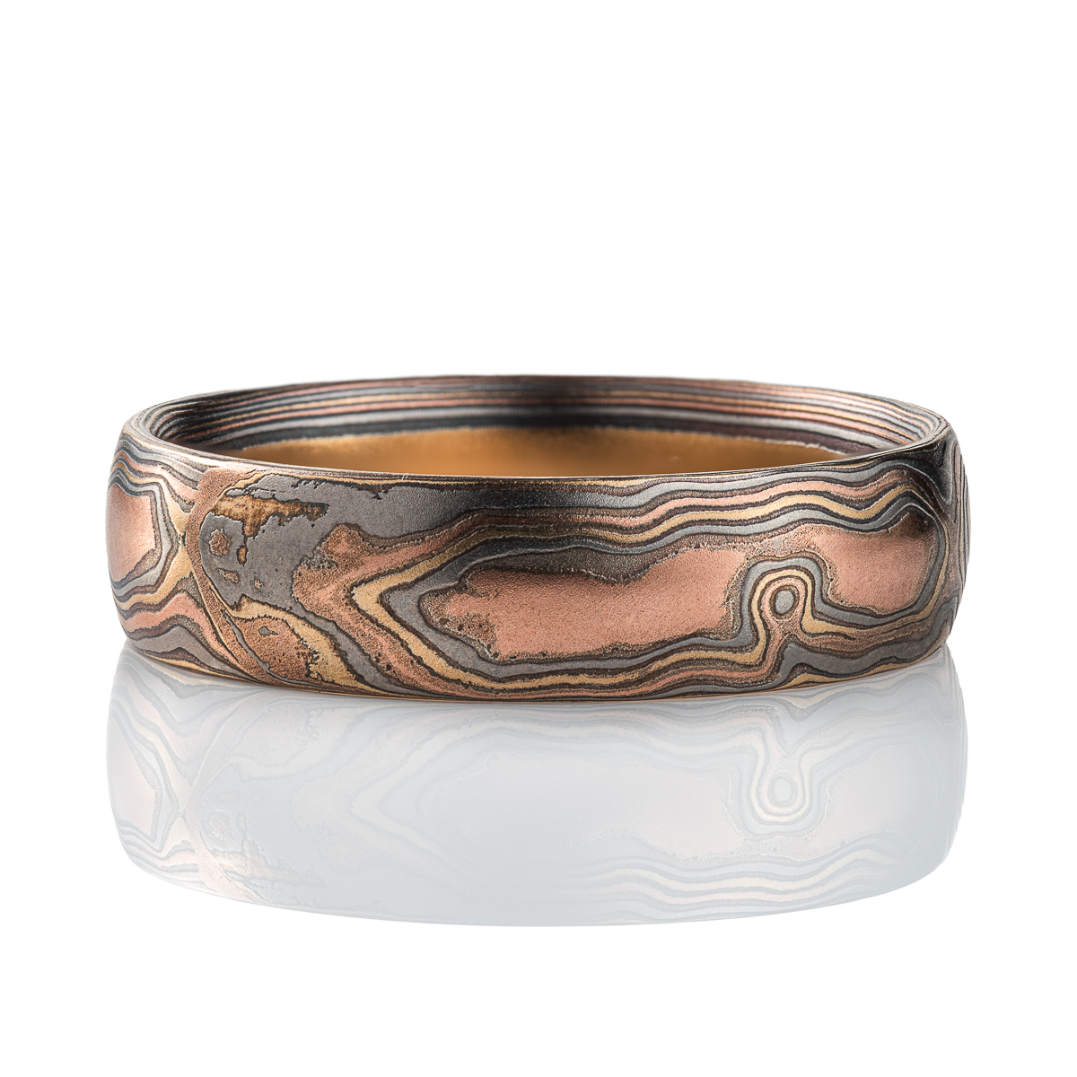 Mens style mokume gane woodgrain patterned band, made with red gold, yellow gold, palladium and silver.
