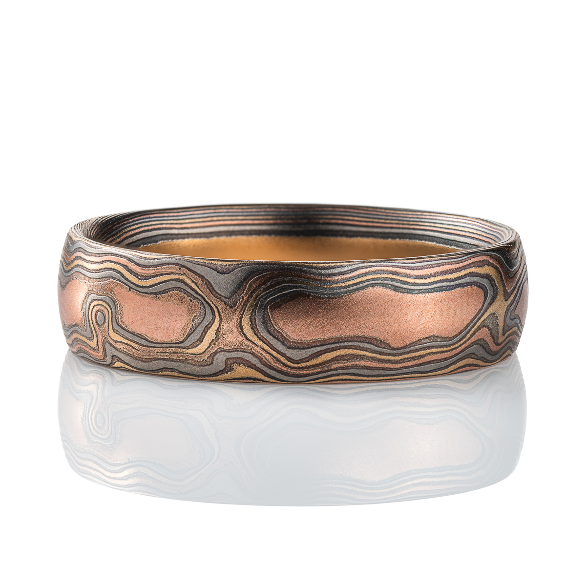 Mens style mokume gane woodgrain patterned band, made with red gold, yellow gold, palladium and silver.