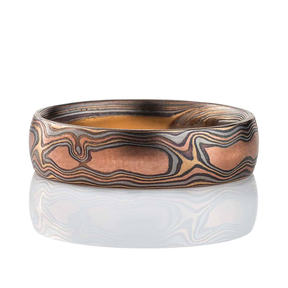 Mens style mokume gane woodgrain patterned band, made with red gold, yellow gold, palladium and silver.