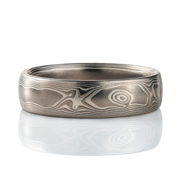 Mokume gane band patterned to resemble woodgrain, made with layers of palladium and silver.
